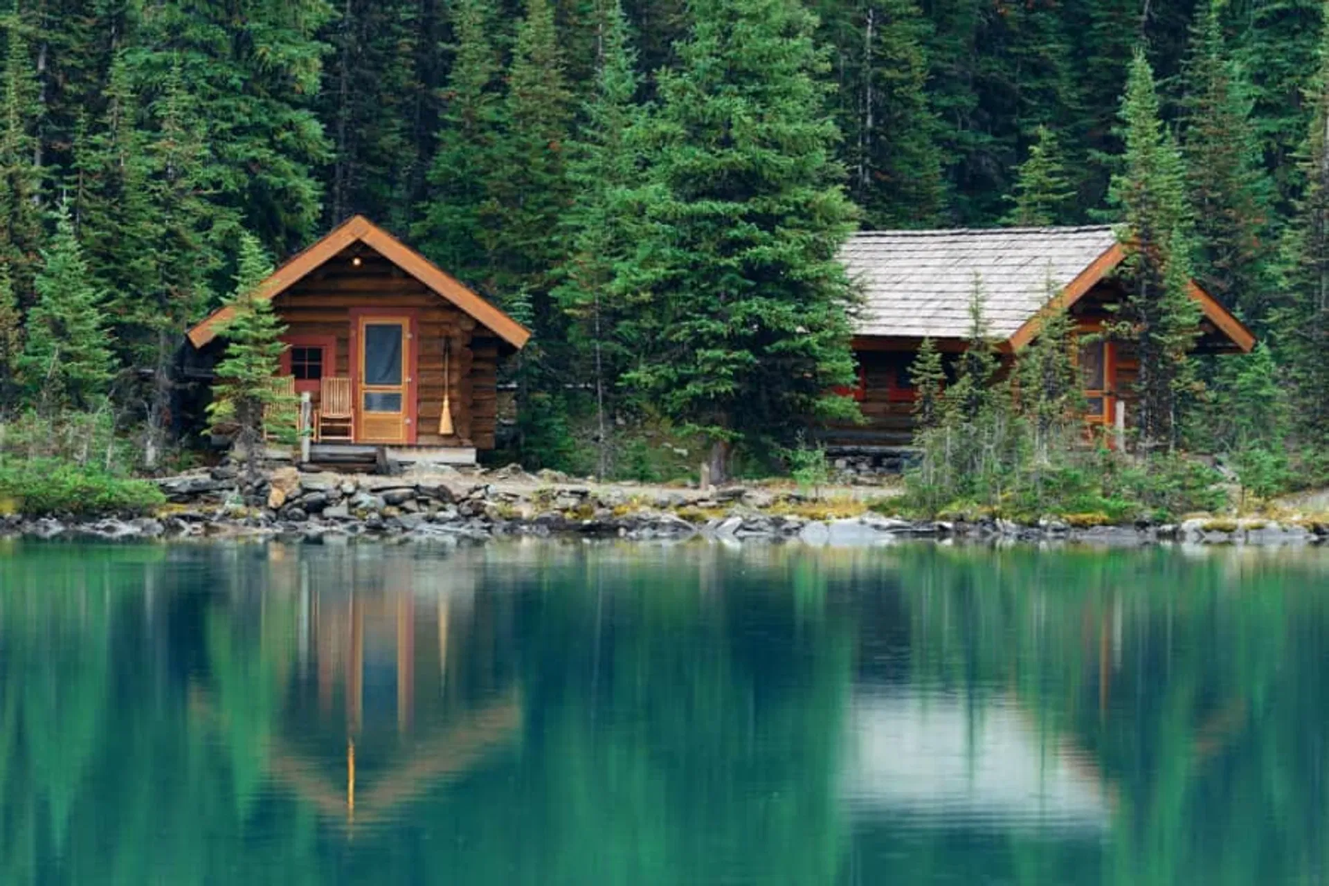 Two cabins by a lake in Norway